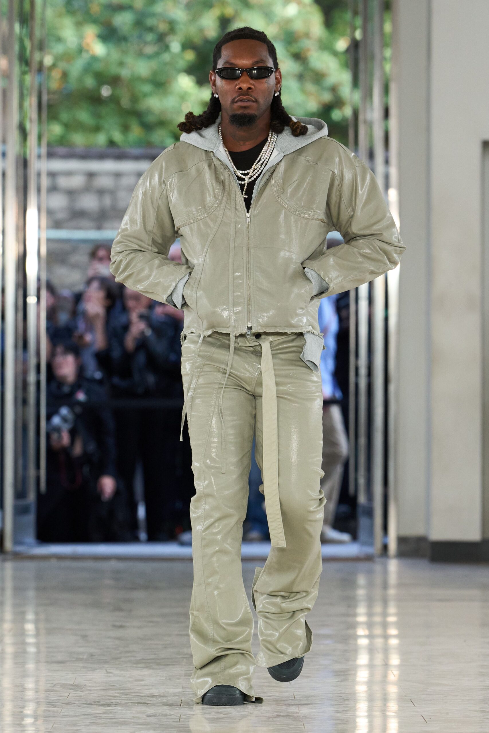 hooded leather jacket with wraparound sunglasses
