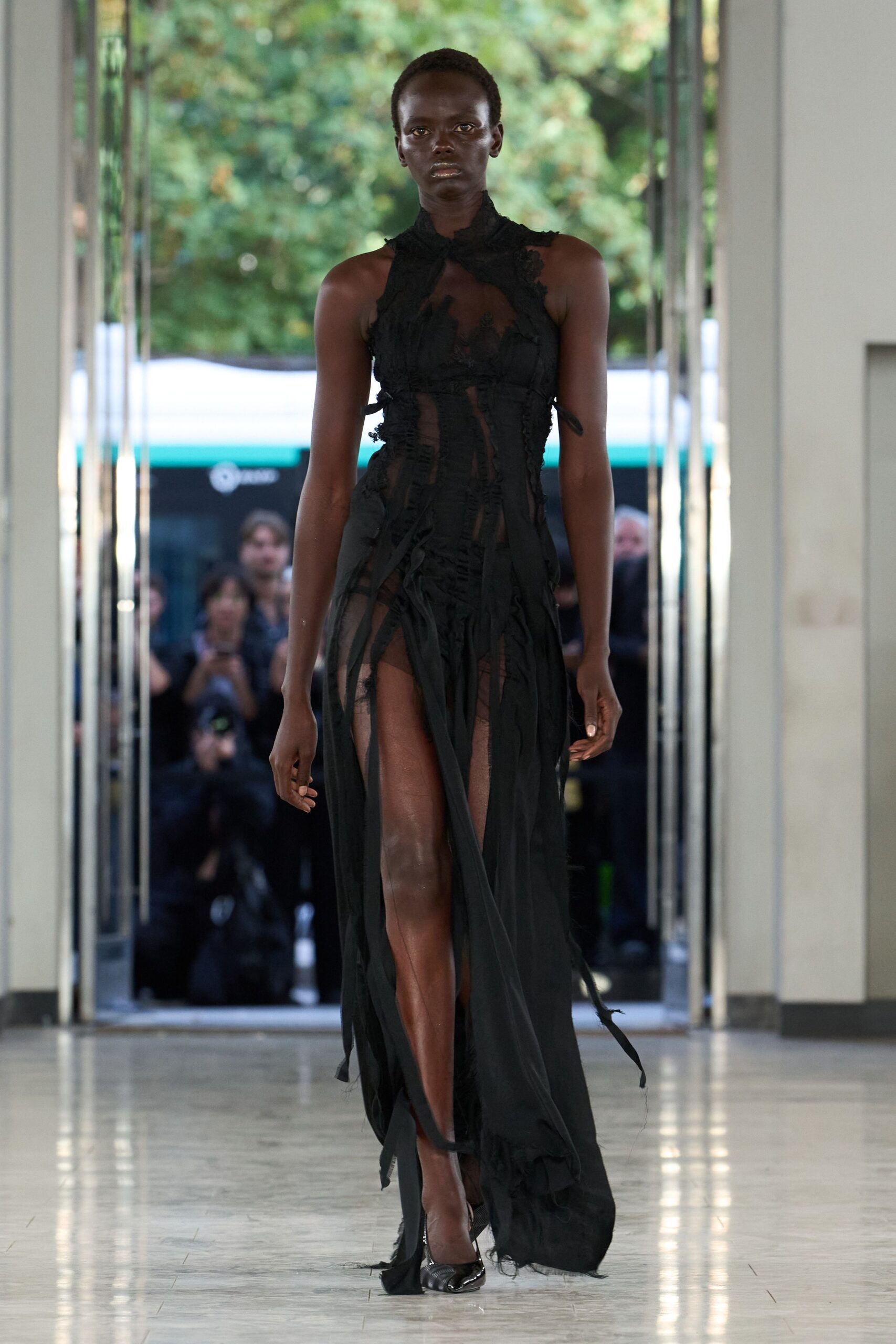 sheer deconstructed black halter gown