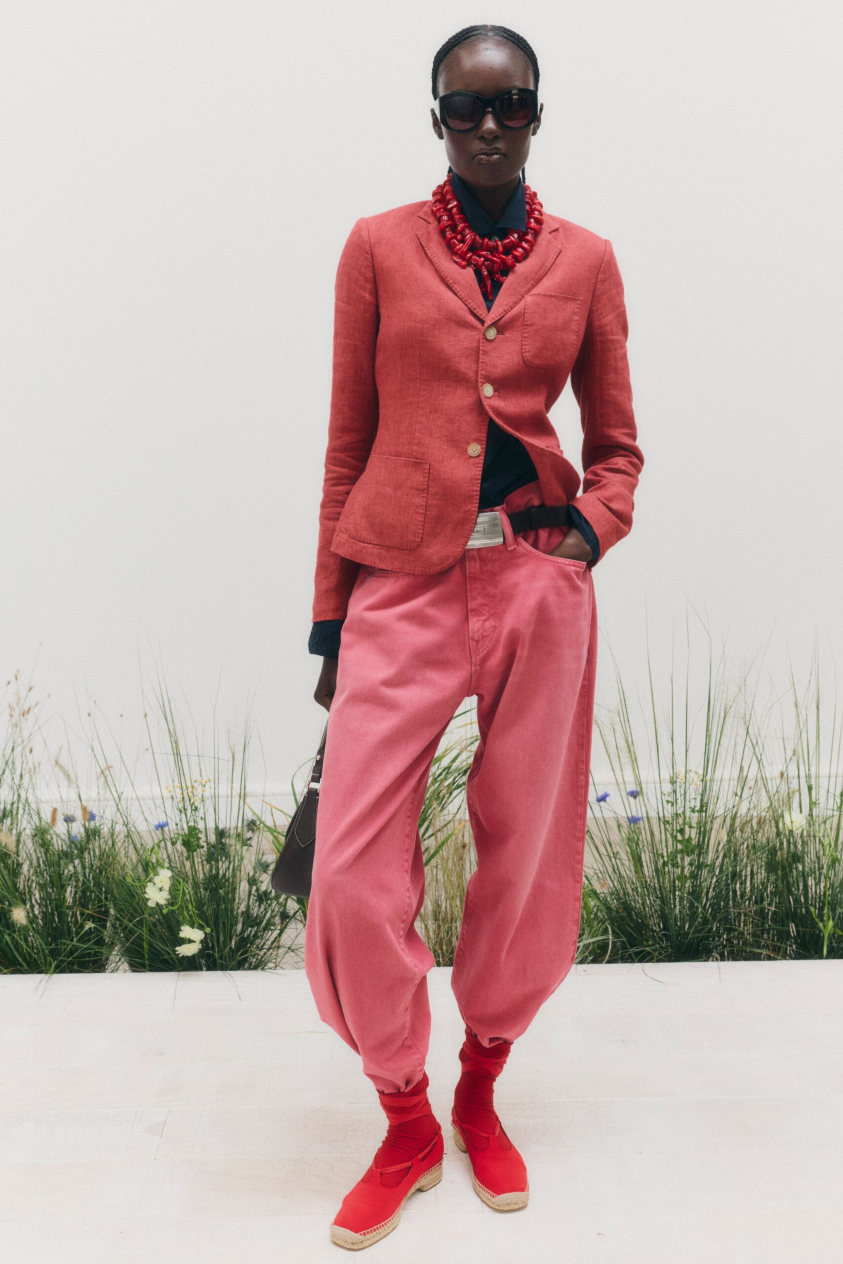 red tailored blazer with pink trousers