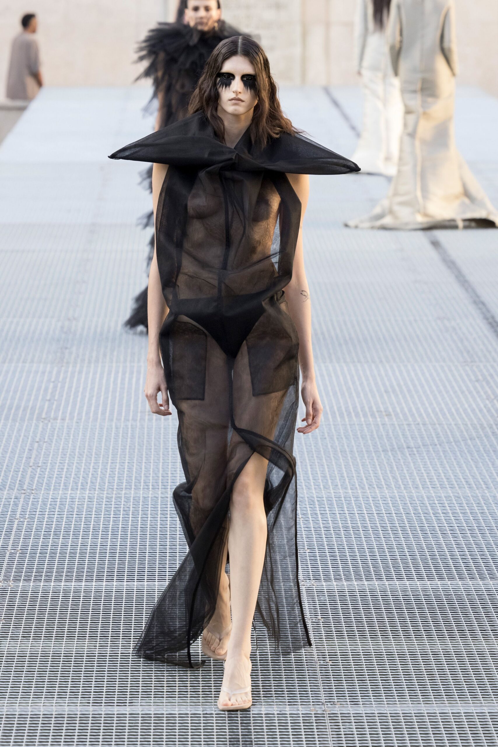 sheer black sculptural collar gown