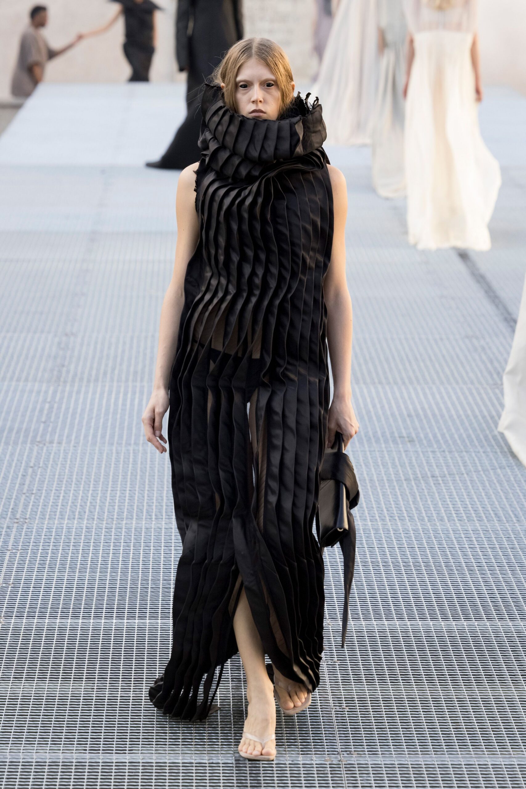 sculptural pleated black funnel-neck gown