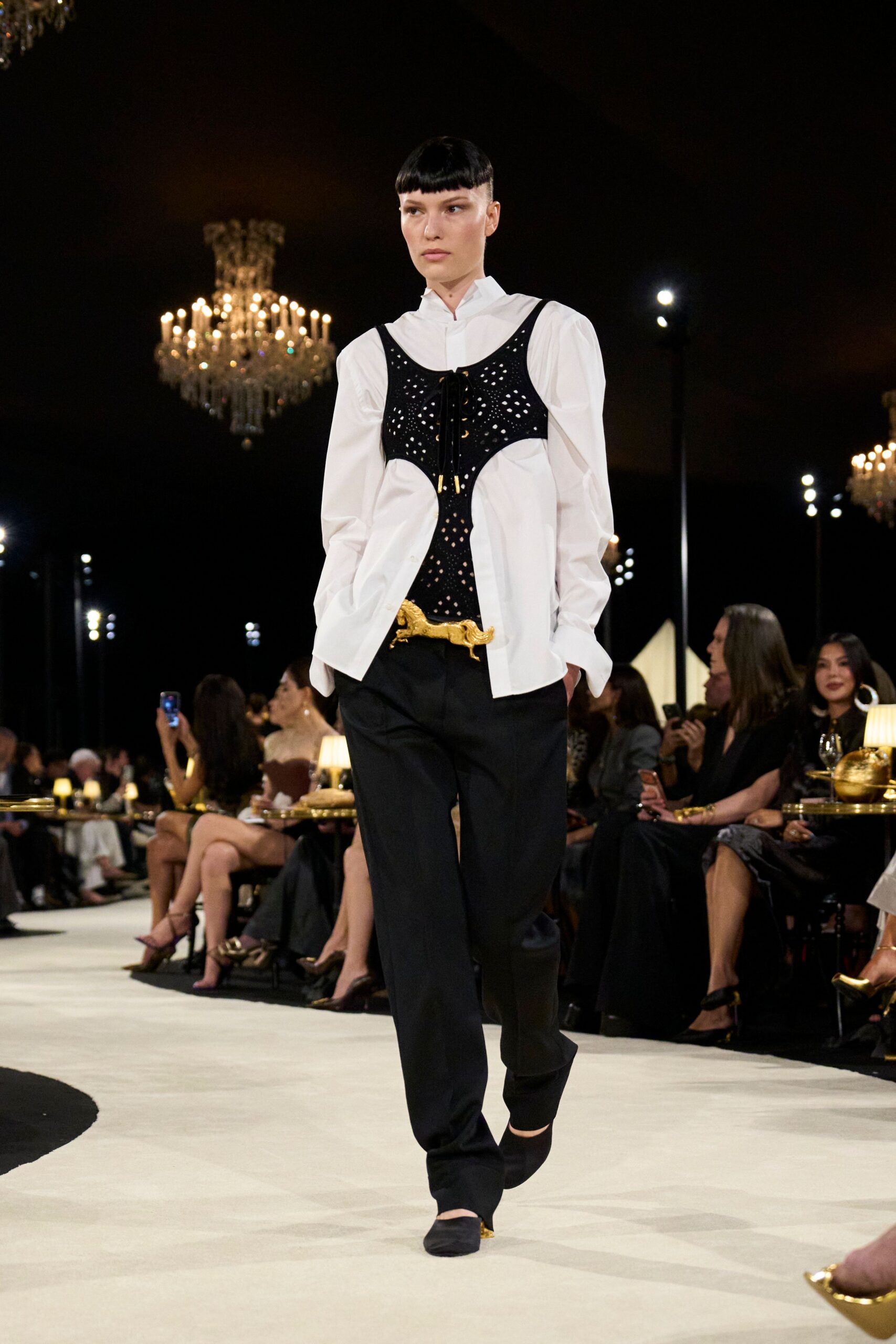 black openwork corset over white shirt