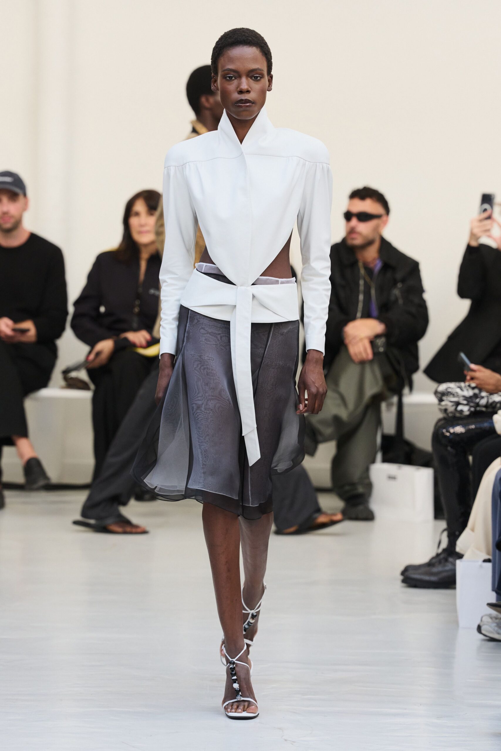 white long-sleeve high-neck structured belted knotted blouse