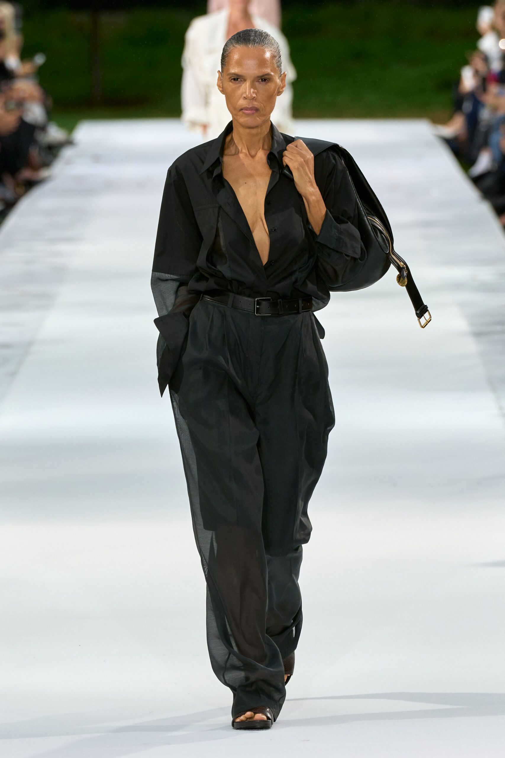 oversized black shirt with sheer trousers