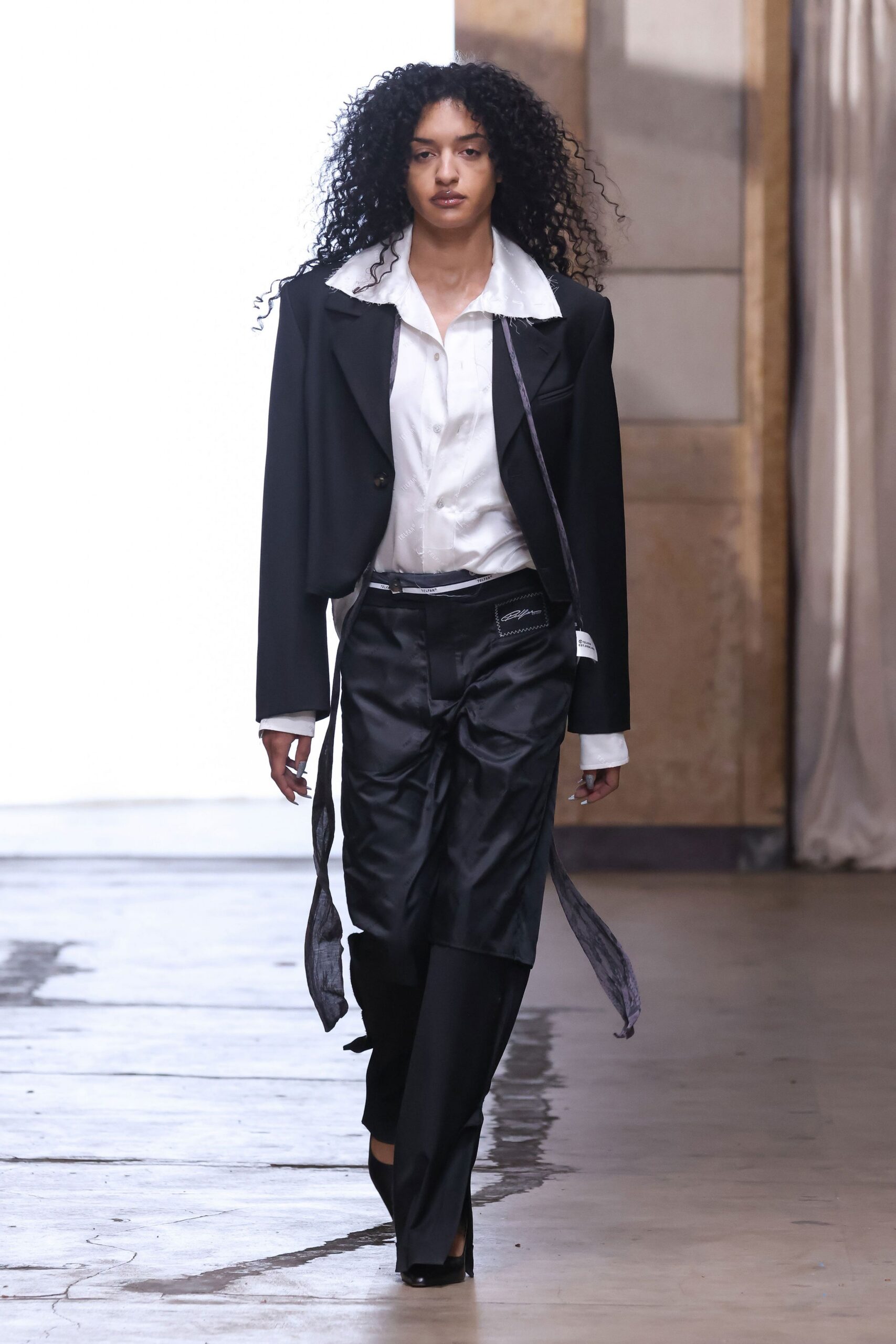 cropped black blazer over satin shirt