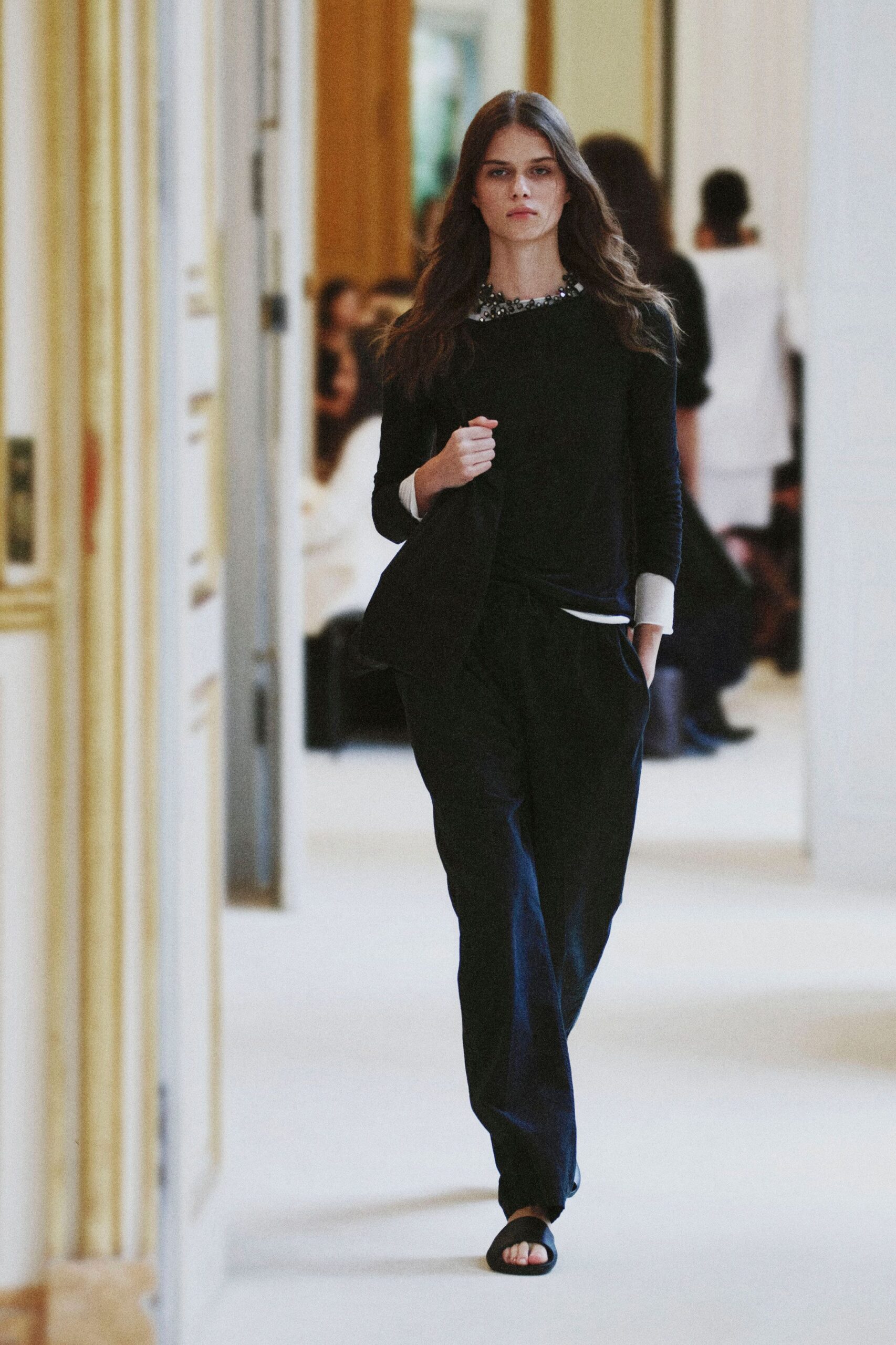 black knit sweater with beaded collar