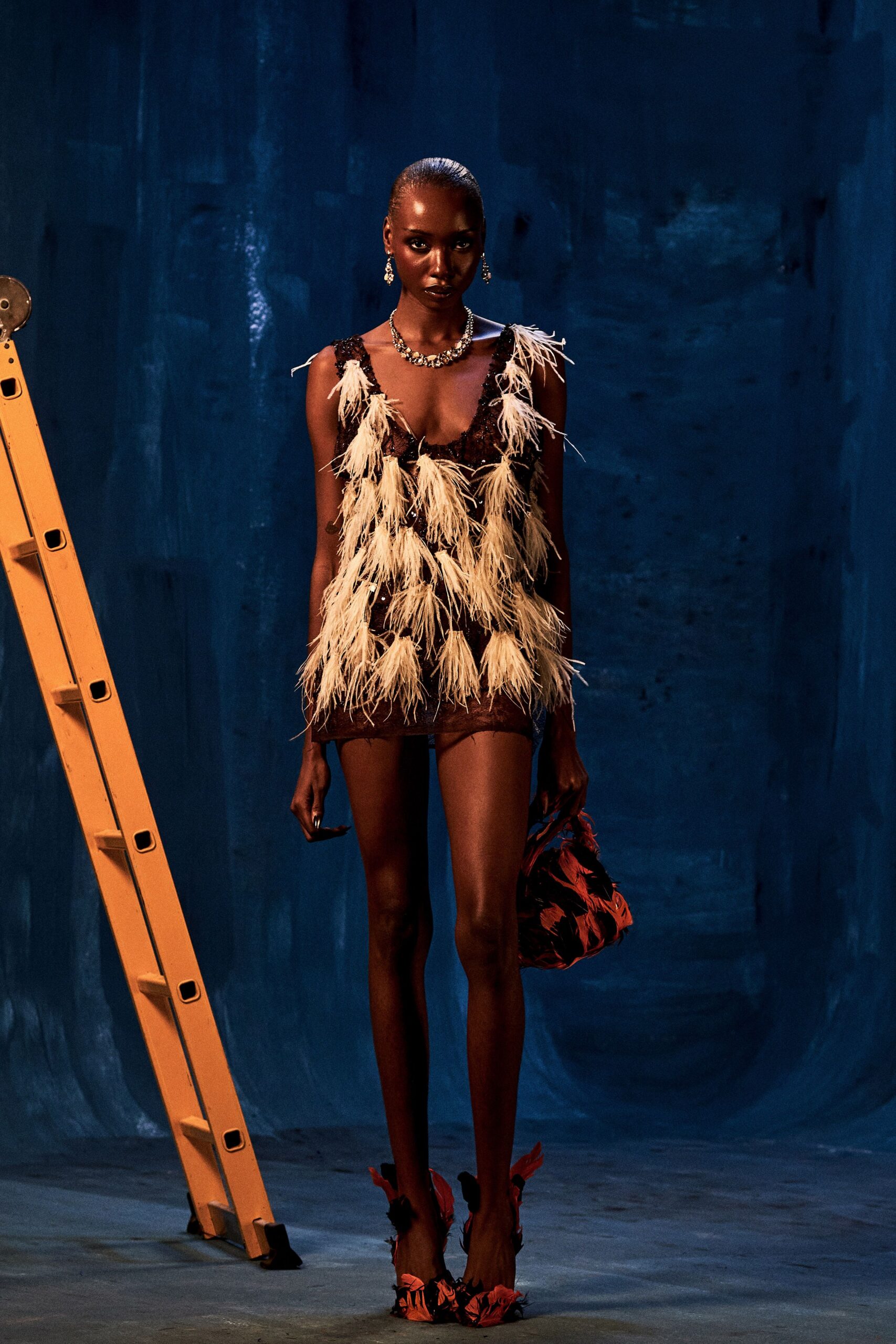 black sequin sleeveless low-cut fitted feathered embellished mini-dress