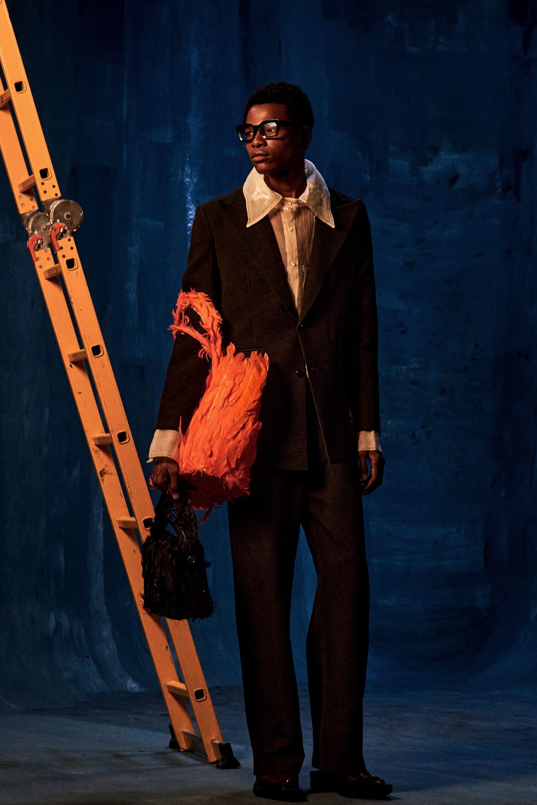 orange feather embellished textured bag