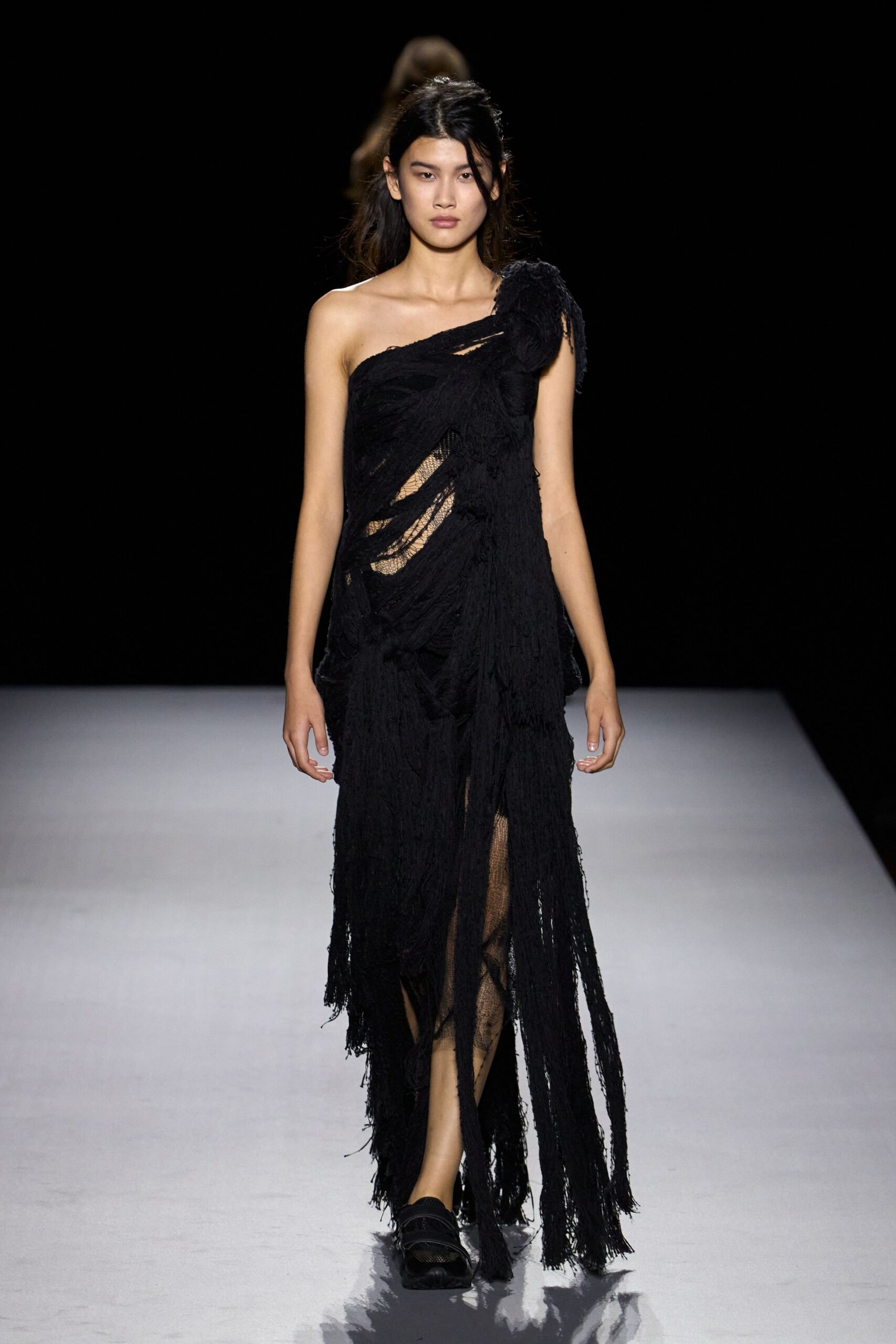 black fringed one-shoulder evening gown