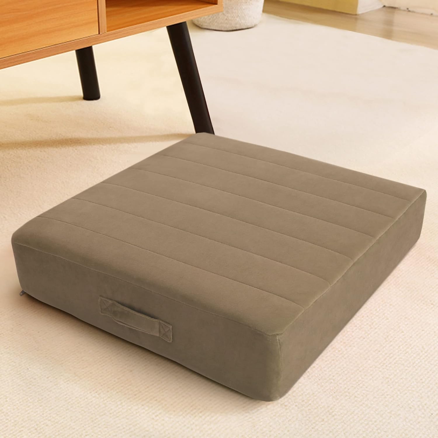 Nice floor pillow. The cover is soft and appears well made. The pillow expanded as expected and fits inside the cover snuggly. It is comfortable, yet firm. Good addition to our family room pillows!