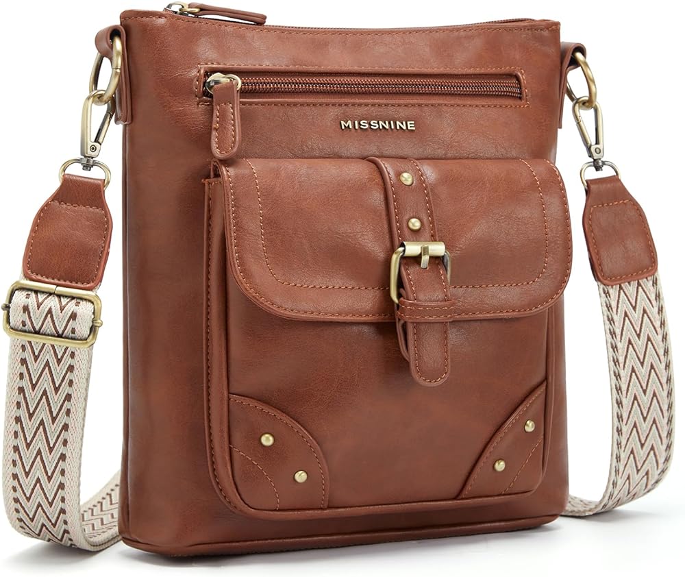 This purse is a great size - small enough for convenience and comfort, but roomy and plenty of space.  Great daily purse. The inside and outside pockets are great for keeping phone, keys, etc. at easy reach. It is an attractive daily purse - I love the look of the strap. It is easier to carry as a shoulder carry than a cross-body. The snap on the very front pocket is placed just a fraction off for quick snapping - I have to look and line it up. But thats a small complaint for an otherwise convenient, comfortable carry purse. I am 5'0 and find the carry strap is a good length for shoulder carry at its shortest length. It has plenty of length to go for taller folks. Under 5'0 could use as a cross-body but may find the strap too long for convenience on the shoulder.