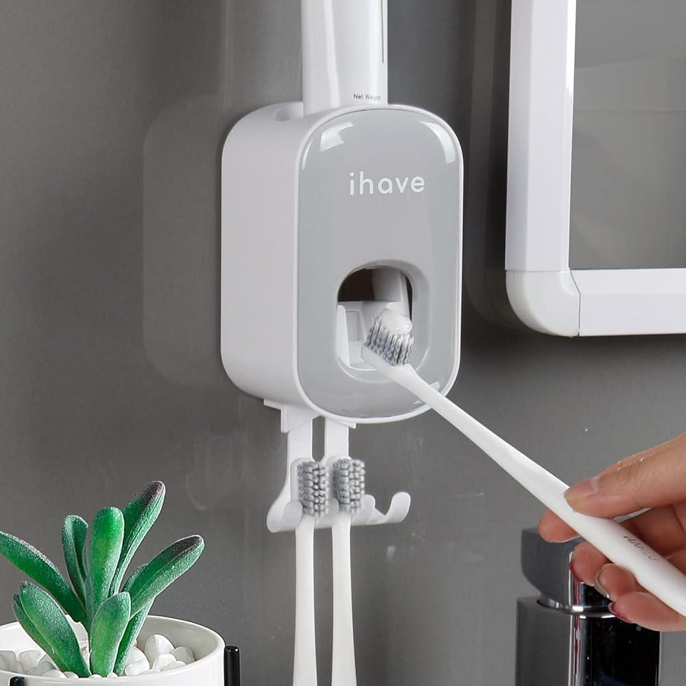 I bought one of these for that bathroom that my two sons share (they are 7). They use sonicare toothbrushes and it works great for them. It was so nice, I got one for my wife and my bathroom as well.It is very easy to attach a tube, you just push it down and give it a couple of twists. The toothpaste dispenses on the brush pretty well. Once in a while some falls of the brush and ends up on the dispenser, but not too often. It's very easy to clean when that happens. Usually I can just wipe it off with a finger, but if it needs a more thorough clean, the entire front panel snaps off easily and the part you push with your toothbrush also comes out very easily, just a little squeeze and it detaches. Those are really the only two parts that could conceivably get toothpaste on them.I didn't use the included mounting tape because it seems like if I ever needed to remove it in the future it would take a good chunk of the drywall with it. I used 3M's Command hanging strips. They are sort of like velcro but more secure. You can take the entire thing off the wall and stick it back up if you want and then if you decide you don't want it anymore, the strips are able to be removed off the wall with no damage whatsoever. I use them for hanging artwork in my house as well. I've removed strips that have been up for years and as long as you do it properly, they come off clean.So the toothpaste dispenser is really really great, especially for the price. Only complaint is that they put the stupid logo right on the front, making it look cheap. Would be nice to have a clean front, or maybe to have options for higher end finishes, like brushed nickel or wood grain or something.