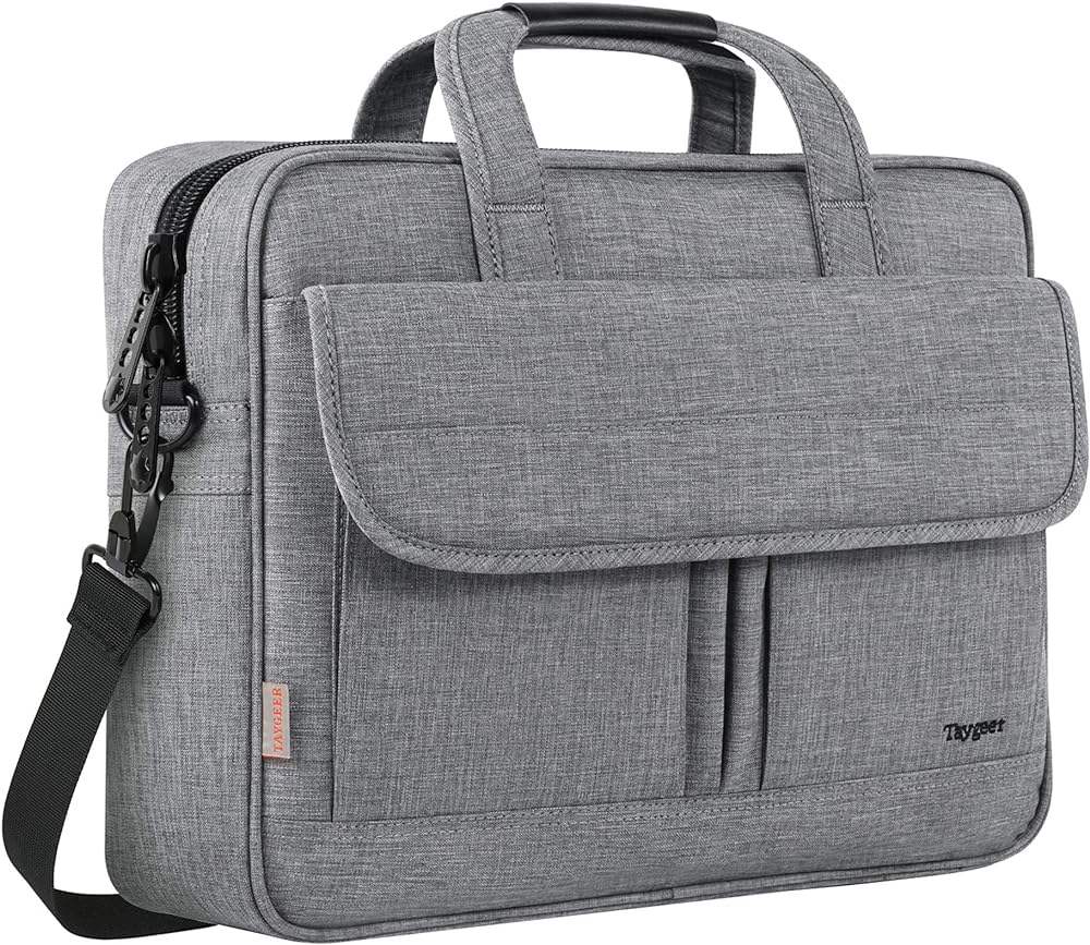 I purchased this bag to replace an old Buxton brand laptop bag shown to the left of the Taygeer bag. It looks like a brand new item should look with absolutely no damage and feels sturdy with a heavy-duty zipper, well-attached handles, and canvas feel with a smooth appearance. My laptop measurements are 15.6" diagonal screen, with the lid closed is 14-13/16" left to right, and 9-11/16" front to back. I keep a wireless mouse USB receiver in the USB slot at all times and as you can see in my pics, I can still slide my thumb down one side of the laptop, so it does fit nicely without being overly snug and it does not seem to slide side to side. Word of caution for those who will be placing it on the ground or rough surfaces, it does not have feet on the bottom, so it may wear and scuff over time just like my previous bag. For the price, that is definitely not a deal-breaker for me.There is plenty of room for all of my laptop accessories with room to spare. I transferred everything from my old bag and still have space for a few more items like additional spiral notebooks in the shared laptop section if needed and miscellaneous items behind the front flap if needed.With some of the really damaged pictures of defective, poor quality items these days that I see people posting on Amazon, I have become very skeptical purchasing because I really dislike returning anything, but I am pleased so far with this item even though I have only had it roughly about a week, I do not foresee any issues for my usage. I'm feeling thankful to have received what seems like a decent quality item on the first try. This is my honest and best assessment of this item.